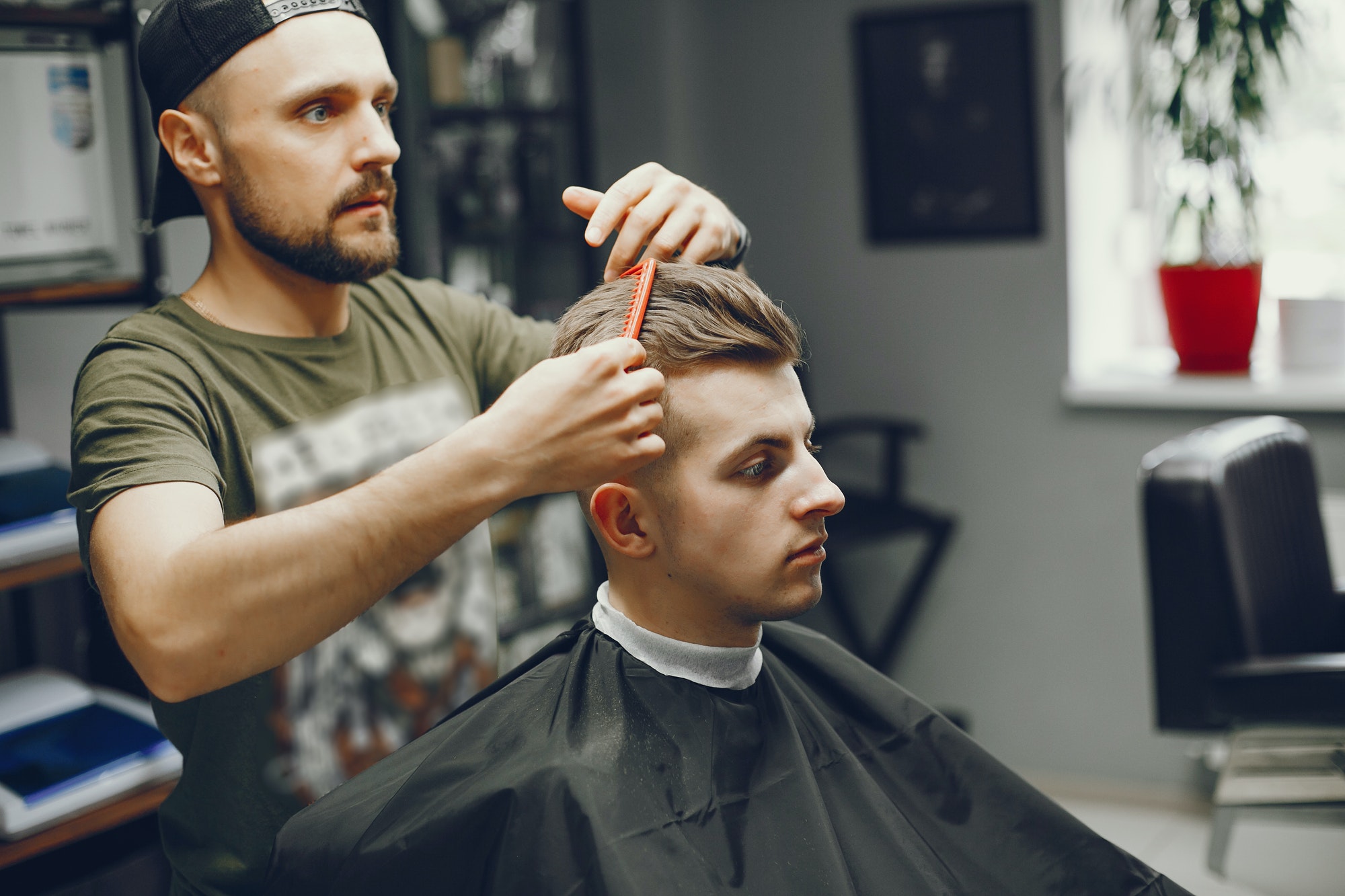 a-man-cuts-hair-in-a-barbershop.jpg