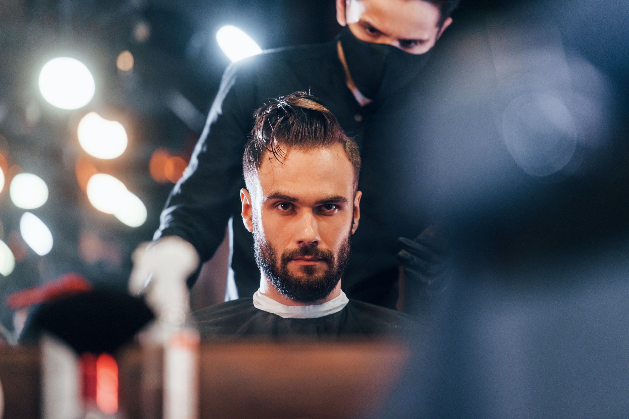 young-stylish-man-sitting-in-barbershop.jpg